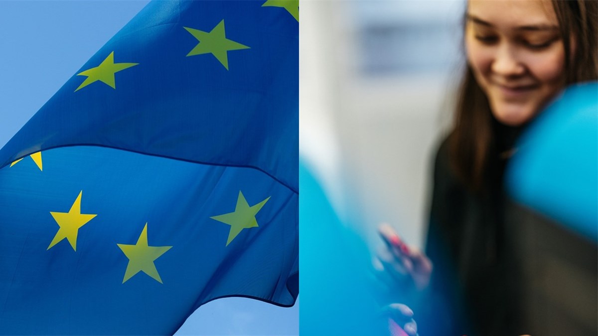 EU-flagga och flicka som tittar på mobil