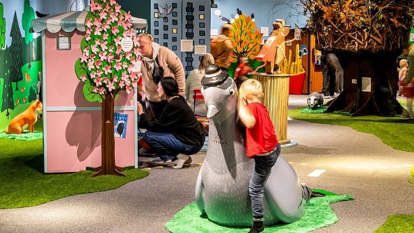 kid playing in a museum