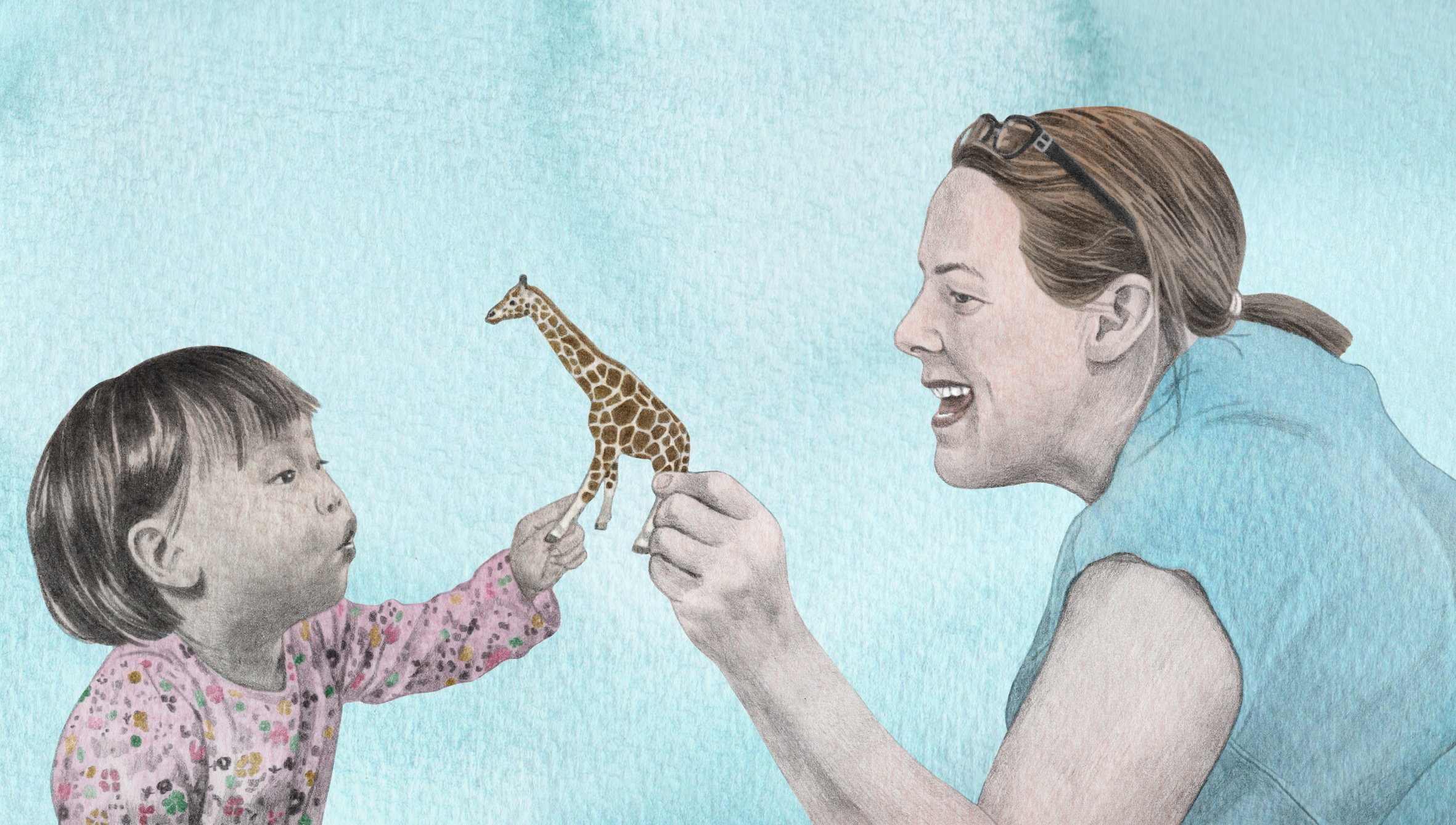 child and parent playing with a toy