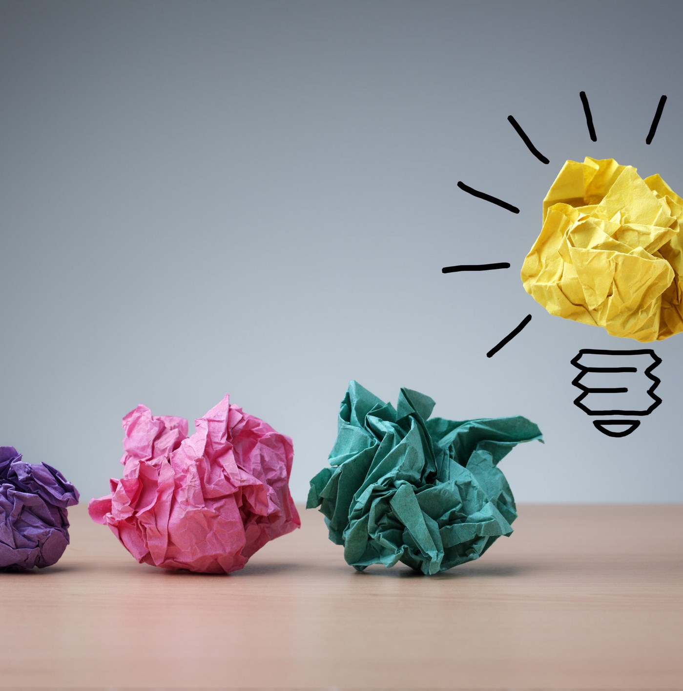 Inspiration concept crumpled paper light bulb metaphor for good idea