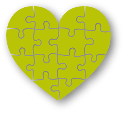 Ett grönt hjärta gjort utav pusselbitar