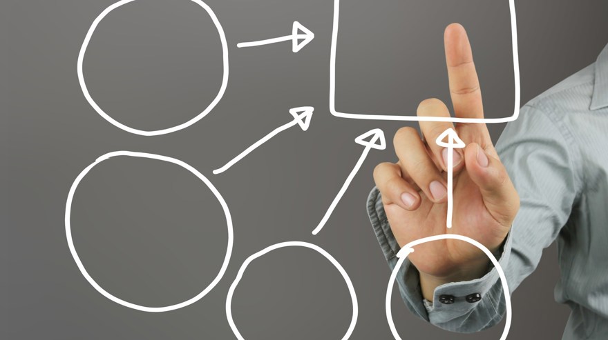 En hand som pekar på en figur