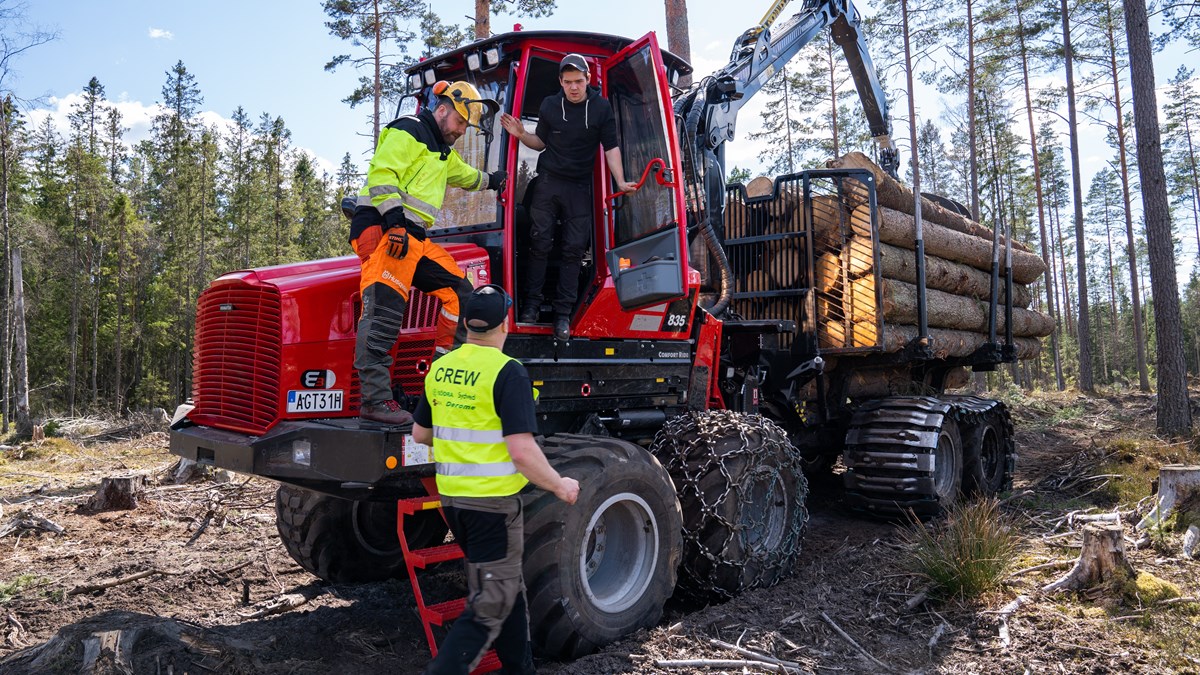  Red forest machine and workers in forest
